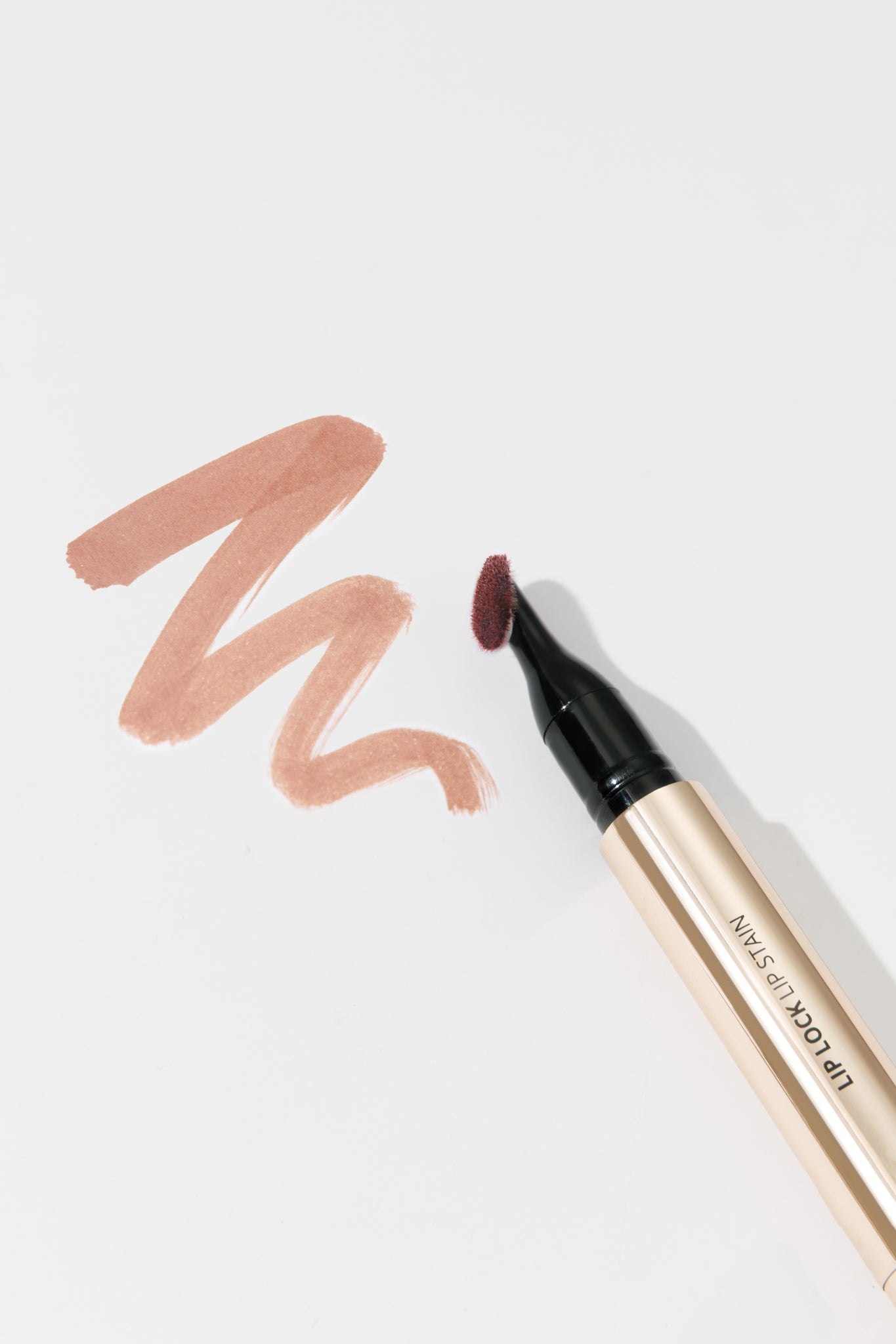 Lip liner with color swatch on a white background