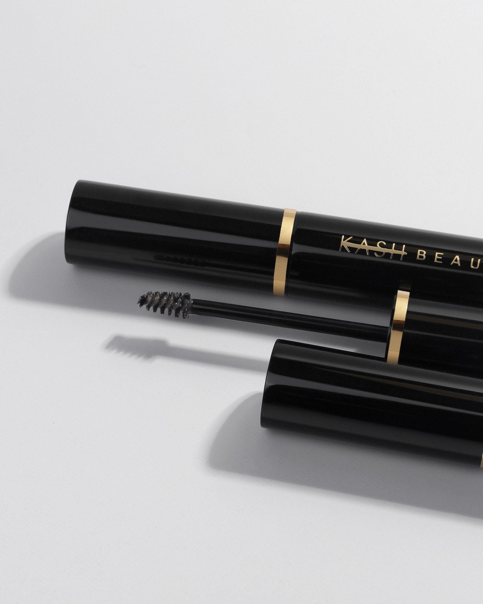 Black mascara with visible Kash Beauty brand name on a light grey background