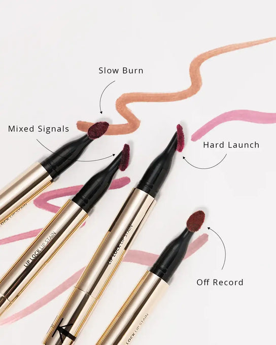 Lip stain pens with a promotional message on a light background