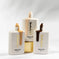 Three KASH Miracle Tint SPF 15 foundation bottles in light, medium, and dark shades.