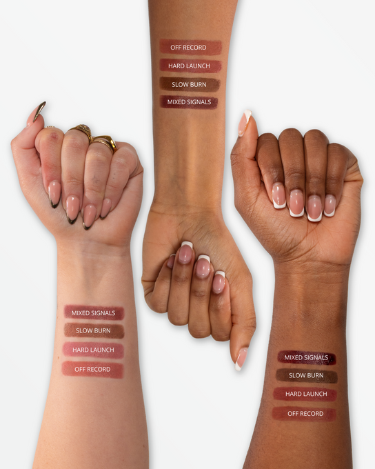 Lip stain pens with a promotional message on a light background