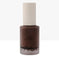 Aura Skin Radiant Foundation bottle with beige cap on white background, makeup product