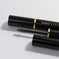 Black mascara with visible Kash Beauty brand name on a light grey background