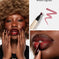 Model with glossy dark lips, long manicured nails, and 'Mixed Signals' lip marker swatch.