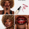 Collage showing woman with bold afro wearing glossy dark red lipstick, burgundy nails, and a close-up of a lipstick pen labeled Mixed Signals.